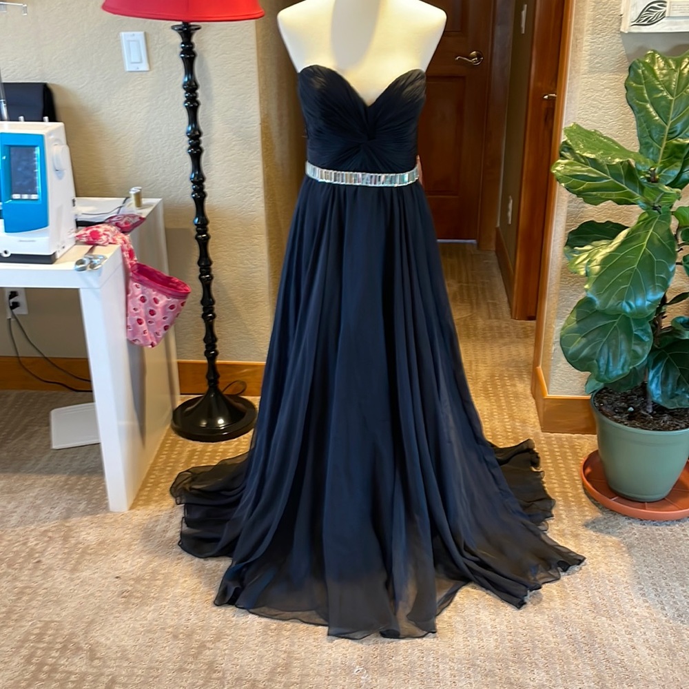 Black, strapless, flowing formal! Black with sparkling belt accent.